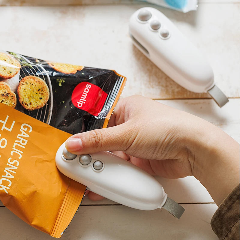 Mini sac de chaleur Machine d'étanchéité Paquet Sacs de scellement Sac de clip de scellage d'aliments en plastique Scellant à main Scellant thermique d'emballage alimentaire